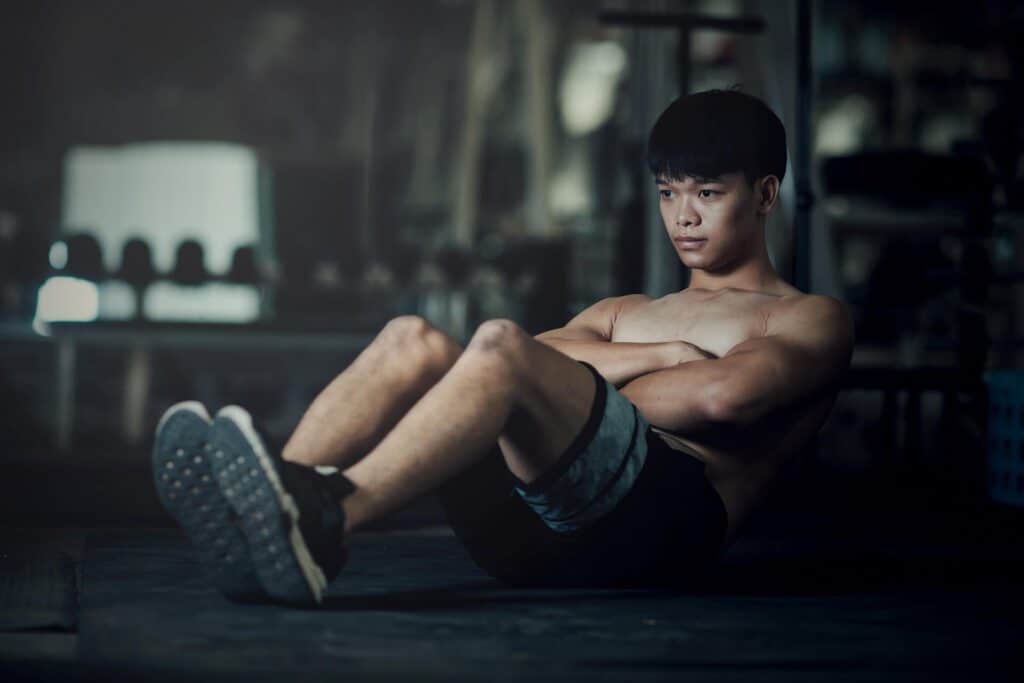 Fitness Man Worming Up Gym