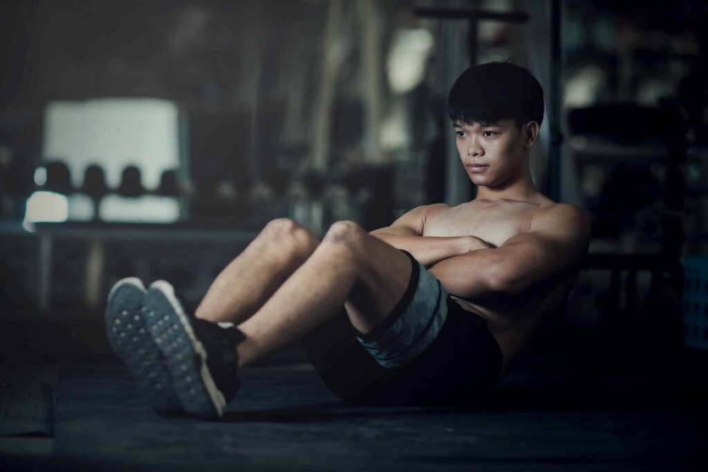 Fitness Man Worming Up Gym